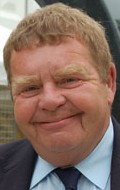Full Geoffrey Hughes filmography who acted in the TV series Keeping Up Appearances.